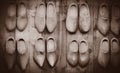 Old wooden dutch clogs on in house Royalty Free Stock Photo