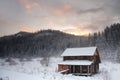 An old wooden dwelling house on view Carpathian mountains. On background of forest and ski slopes. Close up. Winter nature. Heavy Royalty Free Stock Photo