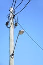 Old wooden electricity post with street lamp Royalty Free Stock Photo