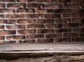 Old wooden empty table and brick wall in the background Royalty Free Stock Photo