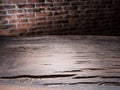 Old wooden empty table and brick wall in the background Royalty Free Stock Photo