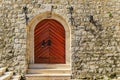 Old wooden entrance gate of the ancient Citadel fortress in Budva Old Town, in Montenegro, Balkans Royalty Free Stock Photo