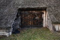 Old wooden entry door to old rustic house in Zervynos, Lithuania