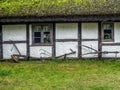 Old wooden farmstead with historical farming implements Royalty Free Stock Photo