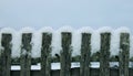 Old wooden fence covered with snow Royalty Free Stock Photo