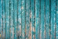 Old wooden fence light green paint peeling board texture. Background Royalty Free Stock Photo