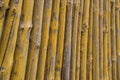 Old wooden fence made of logs in the form of a palisade Royalty Free Stock Photo