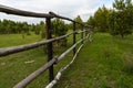 Old wooden fence made of tree trunks Royalty Free Stock Photo