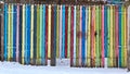 Old wooden fence painted in colorful bright paints Royalty Free Stock Photo