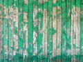 Old wooden fence with peeling green paint Royalty Free Stock Photo