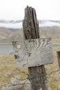 Old wooden fence post and rustic sign Royalty Free Stock Photo