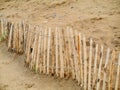 Old wooden fence on a sand dune to stop erosion Royalty Free Stock Photo