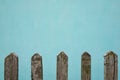 Old wooden fence, the wall whitewashed by lime in sea wave color on background , place for text Royalty Free Stock Photo