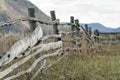Old wooden fencing on mountain backgruond. Rustic landscape