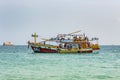 old wooden ferry boat brings tourists to the small island of Koh Samet