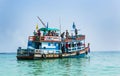 old wooden ferry boat brings tourists to the small island of Koh Samet
