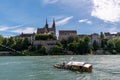 Old wooden ferry boat transfers passengers from Klein Basel to Basel only with the Rhine river current