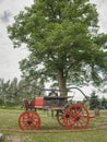 The old wooden fire truck on grass. Vintage wooden fire truck