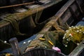 old wooden fisherman boat with a paddle. Inside is a fishing net and other fishing gear. A good way to make money for the Royalty Free Stock Photo