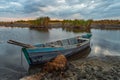 Old wooden fisherman`s boat on the lake Royalty Free Stock Photo