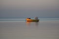Old wooden fishing boat anchored in the sea bay Royalty Free Stock Photo