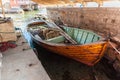 Old wooden fishing boat in a boat house Royalty Free Stock Photo