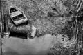 Old wooden fishing boat on lake coast Royalty Free Stock Photo