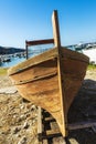 Old wooden fishing boat moored on the beach in Italy Royalty Free Stock Photo