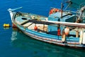 An old fishing boat anchored in the clear waters of the Ionian Sea Royalty Free Stock Photo