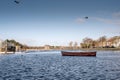 Old wooden fishing boat. River Corrib, Galway city, Ireland, Warm sunny day. Nobody. Blue cloudy sky and water. Outdoor activity Royalty Free Stock Photo