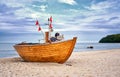 Old wooden fishing boat on sandy beach in the Baltic Sea resort of Binz. Island RÃÂ¼gen, Germany Royalty Free Stock Photo