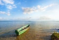 Old wooden fishing boat on summer lake bank Svityaz, Ukraine Royalty Free Stock Photo