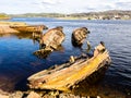 Old wooden fishing boats sinked in the sea. Teriberka, Murmansk Oblast, Russia Royalty Free Stock Photo