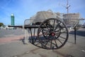 Old wooden fishing cart with crab baskets covered with a net at the market place in Buesum on the north sea coast Royalty Free Stock Photo