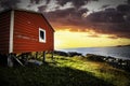 Old wooden fishing gear storage shed on the Atlantic Coast overlooking the water at Bonavista Newfoundland Canada at sunset Royalty Free Stock Photo