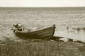 Old wooden fishing motor boat at the lake bank Royalty Free Stock Photo