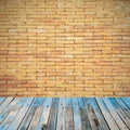 Old wooden floor on brick wall grung background