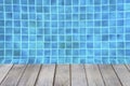 Old wooden floor over clear blue swimming pool background Royalty Free Stock Photo