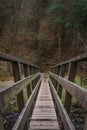 Old Wooden Footbridge With Forest Foliage In Background. Royalty Free Stock Photo