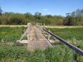 Old wooden footbridge with no sides