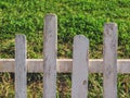 Old garden fence with green grass Royalty Free Stock Photo