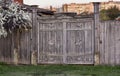 Old wooden gate in a dilapidated warped village Royalty Free Stock Photo