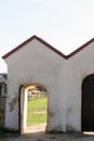 The old wooden gate at the entrance to the church. The open doors of the house of the Lord. The place of worship and prayer of Royalty Free Stock Photo