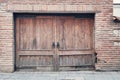 Old wooden gate with a large round handles Royalty Free Stock Photo