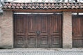 Old wooden gate with a large round metal handles Royalty Free Stock Photo