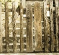 Old wooden gate with lock. Background. Detail of the old wooden door with a rusty metal lock. Royalty Free Stock Photo