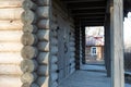 Old wooden gate of a rustic barn, rural building warehouse. Entrance to an old rural village shed, porch of a log house Royalty Free Stock Photo