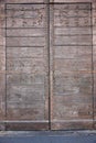 Old wooden gates lined with metal plates Royalty Free Stock Photo