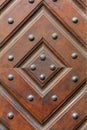 Old wooden geometrical orament with iron rivets