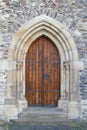 Old wooden gothic church door - with stairs